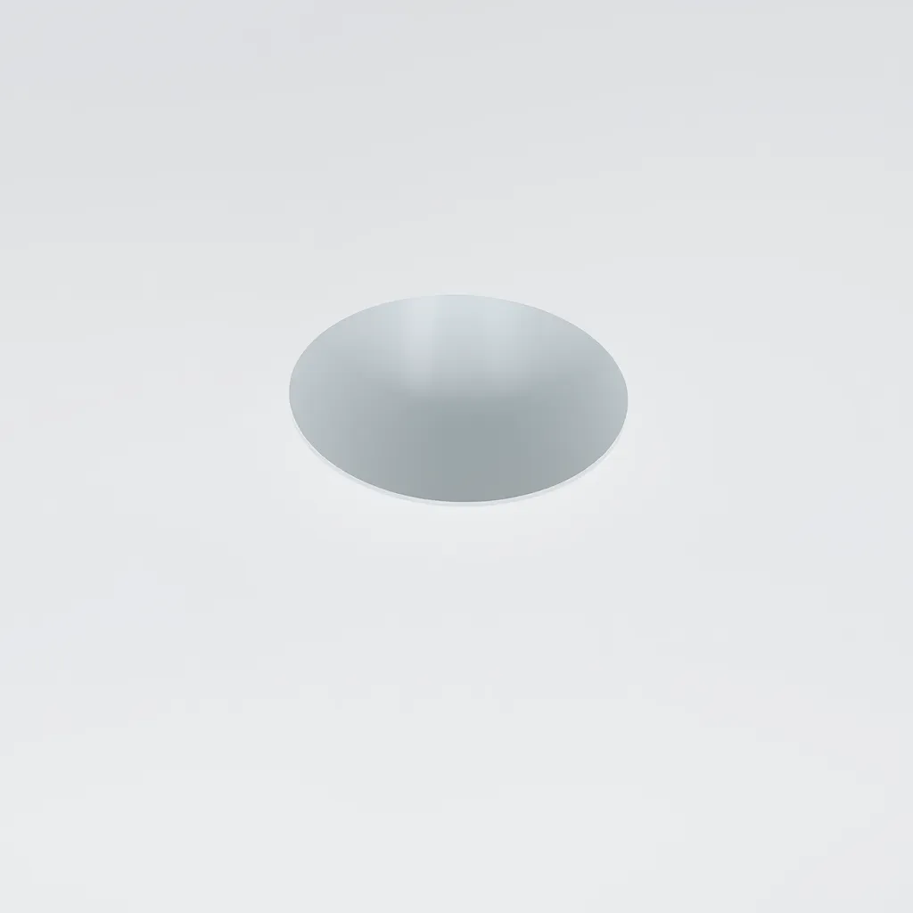 A clean installation of a circular LED downlight in a ceiling.